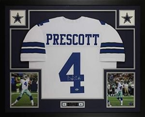 Dak Prescott Autographed White Dallas Jersey - Beautifully Matted and Framed - Hand Signed By Dak Prescott and Certified Authentic by Beckett - Includes Certificate of Authenticity